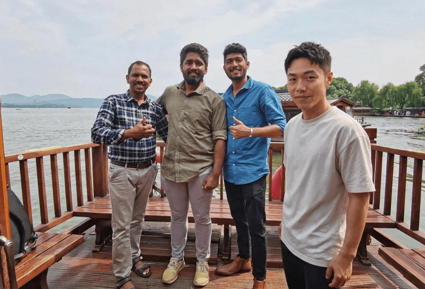 Travelers and local guide on a West Lake boat in Hangzhou