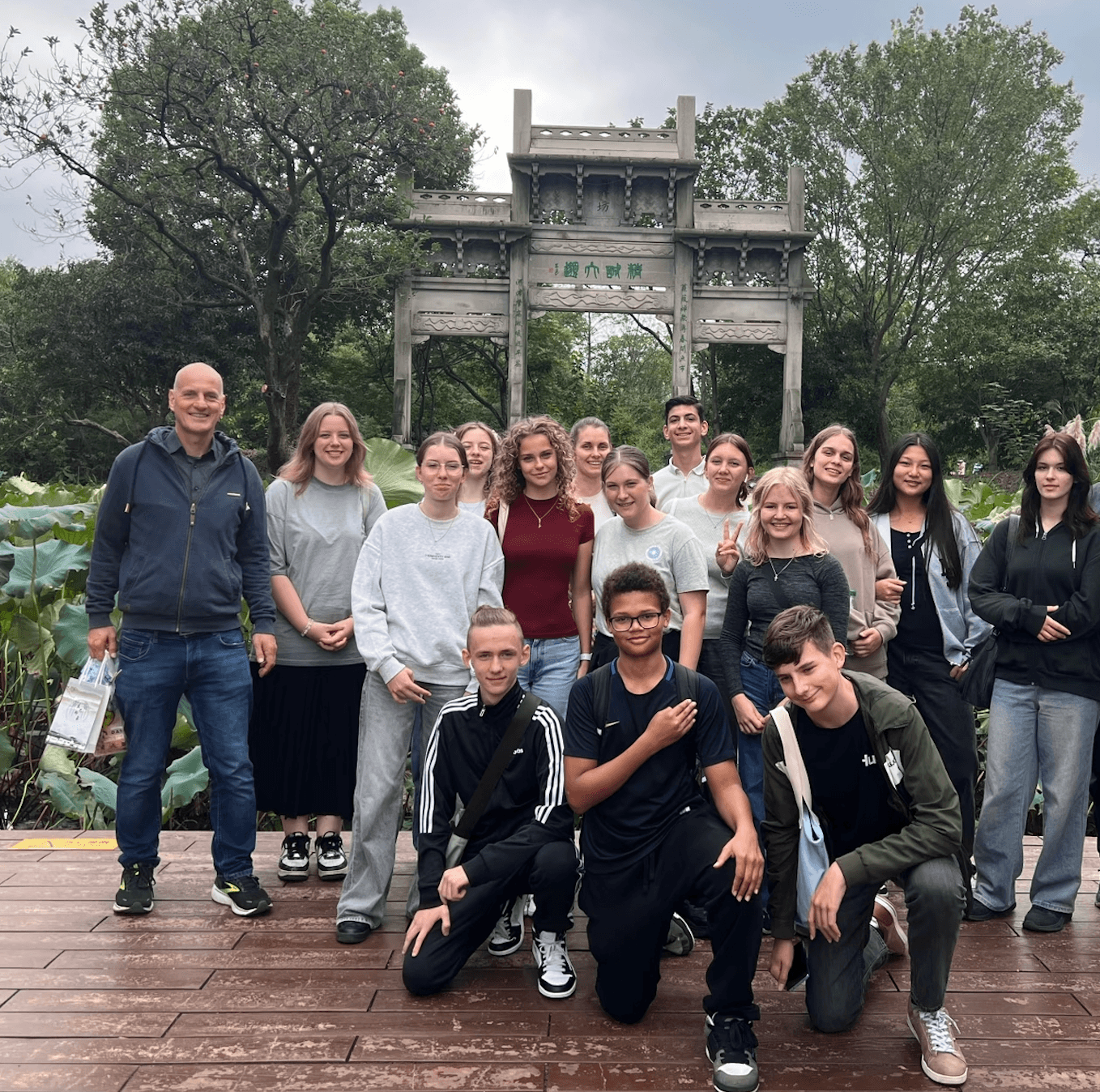 Student travel group visiting a Hangzhou garden